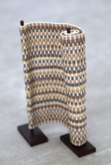 Evolution II, 2020, Cotton, rusted steel Scroll like sculpture with handwoven fabric and rusted steel. Neutral color palette.