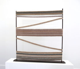 Reflection, 2020, Cotton, rusted steel Sculpture with metal rods on both sides and handwoven fabric in the center.